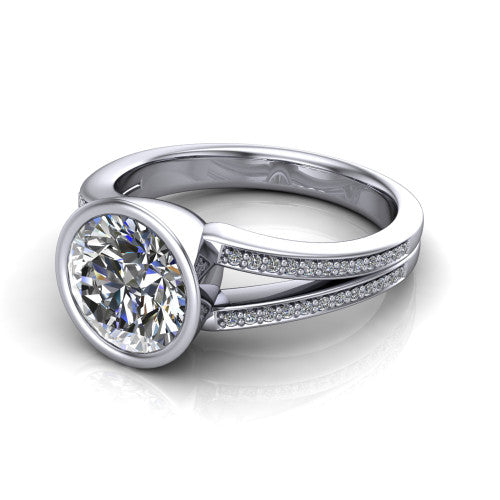 Kaia round classic engagement ring in Platinum, three-quarter perspective showing the round center diamond in a full bezel above a split pave band