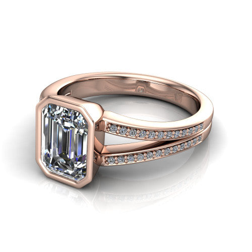 Kaia emerald-cut classic engagement ring in 14K Rose Gold, three-quarter perspective showing the emerald-cut center diamond in a full bezel above a split pave band