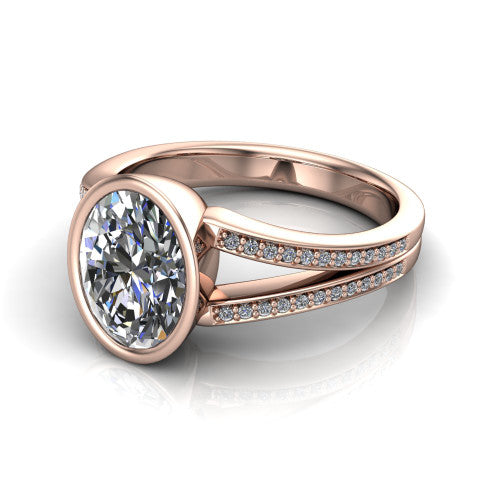 Kaia oval classic engagement ring in 18K Rose Gold, three-quarter perspective showing the oval center diamond in a full bezel above a split pave band