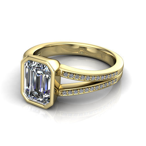 Kaia emerald-cut classic engagement ring in 14K Yellow Gold, three-quarter perspective showing the emerald-cut center diamond in a full bezel above a split pave band