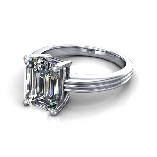 Reagan emerald-cut classic engagement ring in 18K White Gold, three-quarter perspective showing the emerald-cut center diamond above a grooved polished band