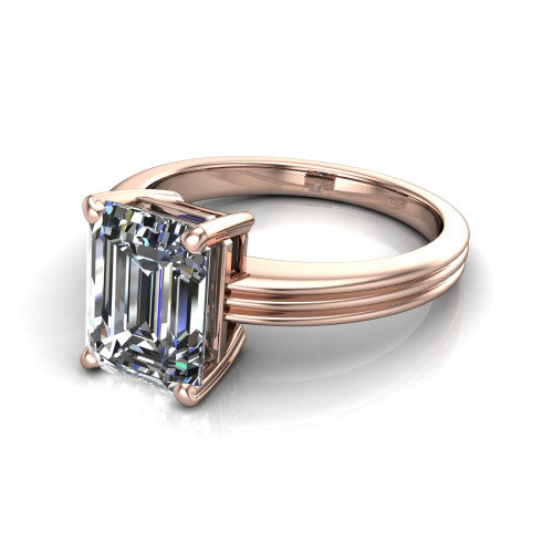 Reagan emerald-cut classic engagement ring in 18K Rose Gold, three-quarter perspective showing the emerald-cut center diamond above a grooved polished band