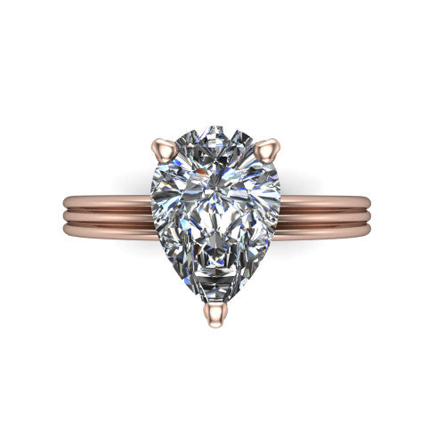 Reagan pear classic engagement ring in 14K Rose Gold, top-down view showing the pear center diamond in its four-prong head from above