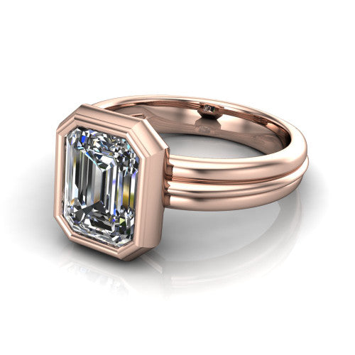 Kehlani emerald-cut classic engagement ring in 14K Rose Gold, three-quarter perspective showing the emerald-cut center diamond in a full bezel above a grooved band