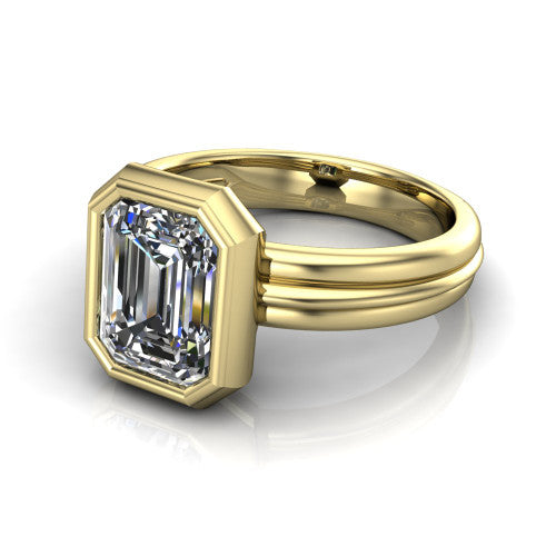 Kehlani emerald-cut classic engagement ring in 18K Yellow Gold, three-quarter perspective showing the emerald-cut center diamond in a full bezel above a grooved band