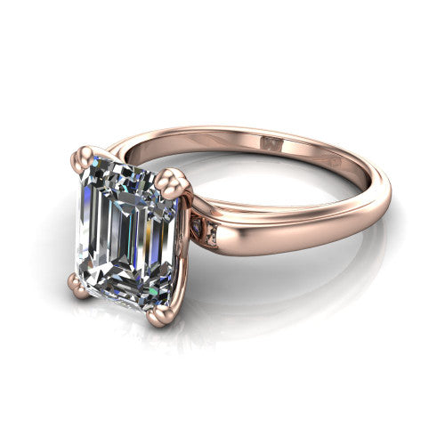 Erika emerald-cut classic engagement ring in 14K Rose Gold, three-quarter perspective showing the emerald-cut center diamond in a four-prong head on a polished band