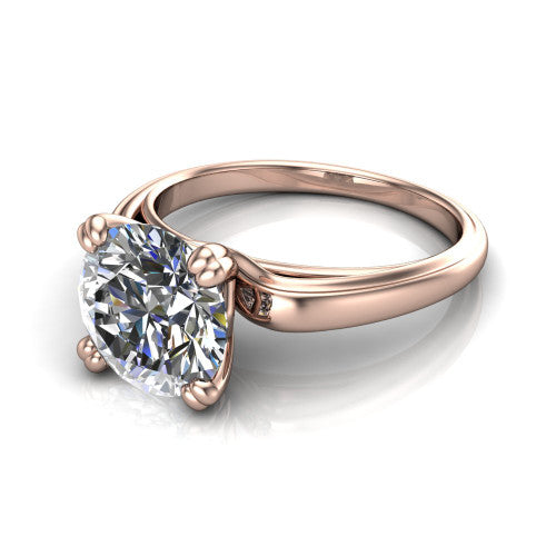 Erika round classic engagement ring in 14K Rose Gold, three-quarter perspective showing the round center diamond in a four-prong head on a polished band