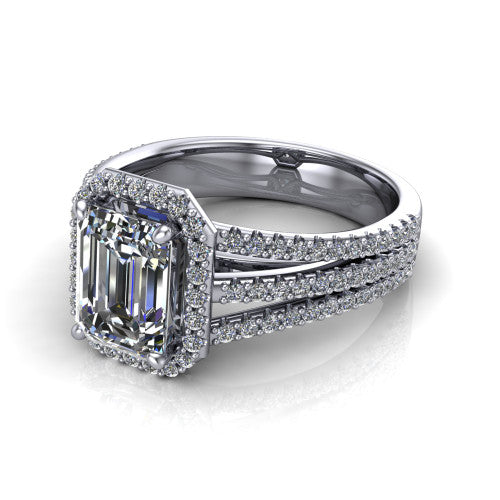 Kamila emerald-cut halo engagement ring in Platinum, three-quarter perspective showing the emerald-cut center diamond in a pave halo above a split triple-row band