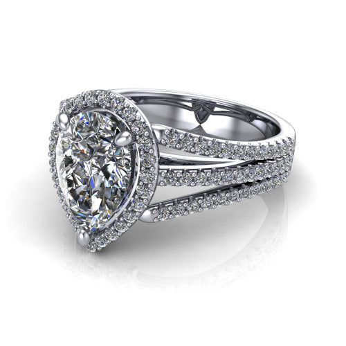 Kamila pear halo engagement ring in Platinum, three-quarter perspective showing the pear center diamond in a pave halo above a split triple-row band
