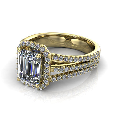 Kamila emerald-cut halo engagement ring in 18K Yellow Gold, three-quarter perspective showing the emerald-cut center diamond in a pave halo above a split triple-row band