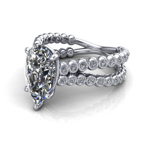 Magnolia pear classic engagement ring in 14K White Gold, three-quarter perspective showing the pear center diamond in a four-prong head above a split bezel-set diamond band