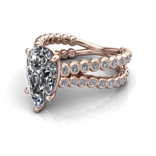 Magnolia pear classic engagement ring in 14K Rose Gold, three-quarter perspective showing the pear center diamond in a four-prong head above a split bezel-set diamond band