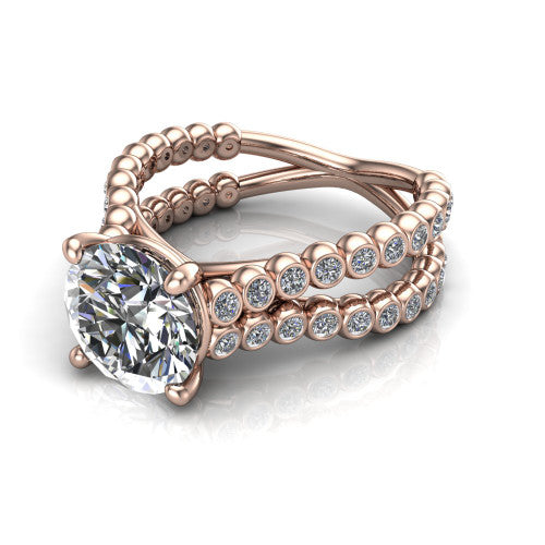 Magnolia round classic engagement ring in 14K Rose Gold, three-quarter perspective showing the round center diamond in a four-prong head above a split bezel-set diamond band