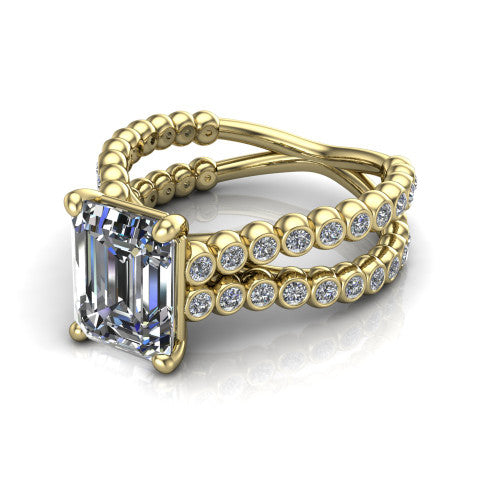 Magnolia emerald-cut classic engagement ring in 18K Yellow Gold, three-quarter perspective showing the emerald-cut center diamond in a four-prong head above a split bezel-set diamond band
