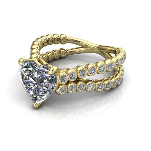 Magnolia heart classic engagement ring in 14K Yellow Gold, three-quarter perspective showing the heart center diamond in a four-prong head above a split bezel-set diamond band