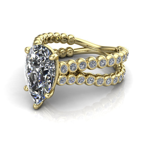 Magnolia pear classic engagement ring in 14K Yellow Gold, three-quarter perspective showing the pear center diamond in a four-prong head above a split bezel-set diamond band