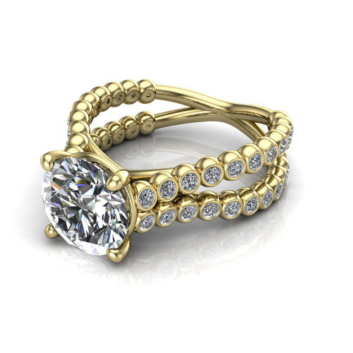 Magnolia round classic engagement ring in 18K Yellow Gold, three-quarter perspective showing the round center diamond in a four-prong head above a split bezel-set diamond band