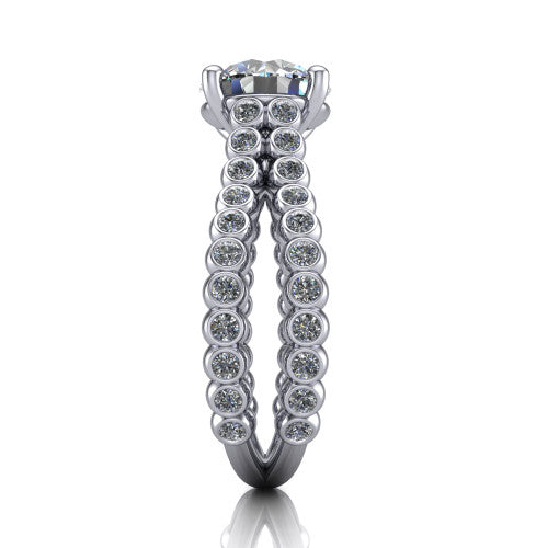 Magnolia round classic engagement ring in Platinum, side profile showing the split bezel-set diamond band in side view