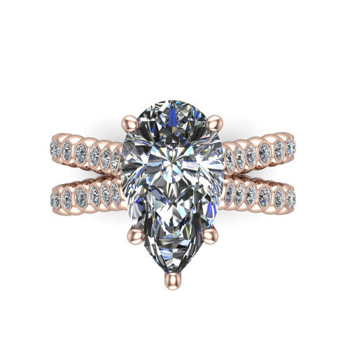 Magnolia pear classic engagement ring in 14K Rose Gold, top-down view showing the pear center diamond and bezel-set shoulders from above