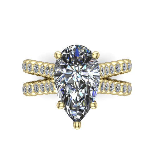 Magnolia pear classic engagement ring in 18K Yellow Gold, top-down view showing the pear center diamond and bezel-set shoulders from above