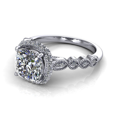 Annie cushion halo engagement ring in Platinum, three-quarter perspective showing the cushion center diamond in a pave halo above a vintage milgrain station band