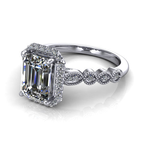 Annie emerald-cut halo engagement ring in 14K White Gold, three-quarter perspective showing the emerald-cut center diamond in a pave halo above a vintage milgrain station band