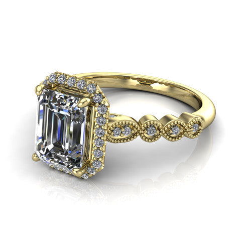 Annie emerald-cut halo engagement ring in 18K Yellow Gold, three-quarter perspective showing the emerald-cut center diamond in a pave halo above a vintage milgrain station band