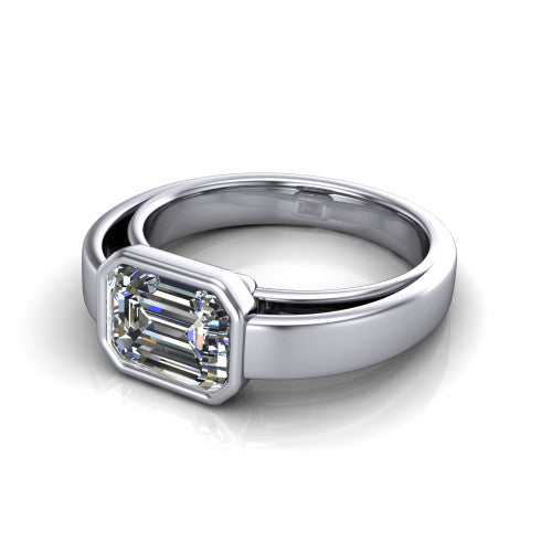 Bony emerald-cut classic engagement ring in 18K White Gold, three-quarter perspective showing the emerald-cut center diamond in a full bezel above a split polished band