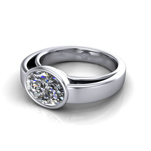 Bony oval classic engagement ring in 14K White Gold, three-quarter perspective showing the oval center diamond in a full bezel above a split polished band