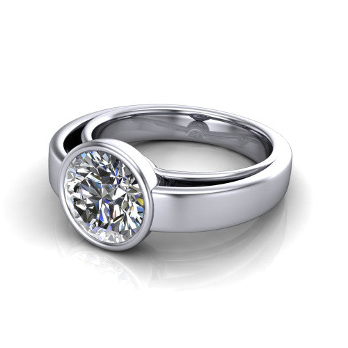 Bony round classic engagement ring in Platinum, three-quarter perspective showing the round center diamond in a full bezel above a split polished band
