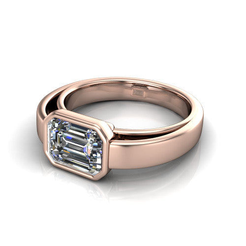 Bony emerald-cut classic engagement ring in 14K Rose Gold, three-quarter perspective showing the emerald-cut center diamond in a full bezel above a split polished band
