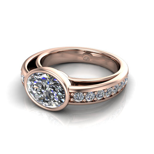 Isabel oval classic engagement ring in 18K Rose Gold, three-quarter perspective showing the oval center diamond in a full bezel above a split diamond band