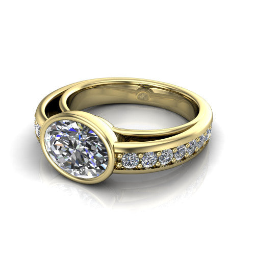 Isabel oval classic engagement ring in 18K Yellow Gold, three-quarter perspective showing the oval center diamond in a full bezel above a split diamond band