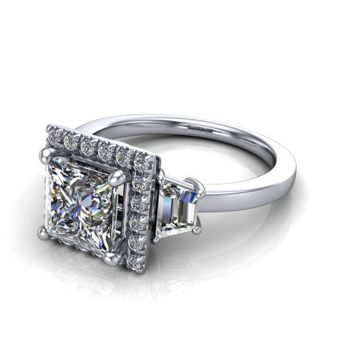 Anabella princess-cut halo engagement ring in 14K White Gold, three-quarter perspective showing the princess-cut center diamond, pave halo, and two trapezoid side stones