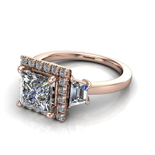 Anabella princess-cut halo engagement ring in 14K Rose Gold, three-quarter perspective showing the princess-cut center diamond, pave halo, and two trapezoid side stones