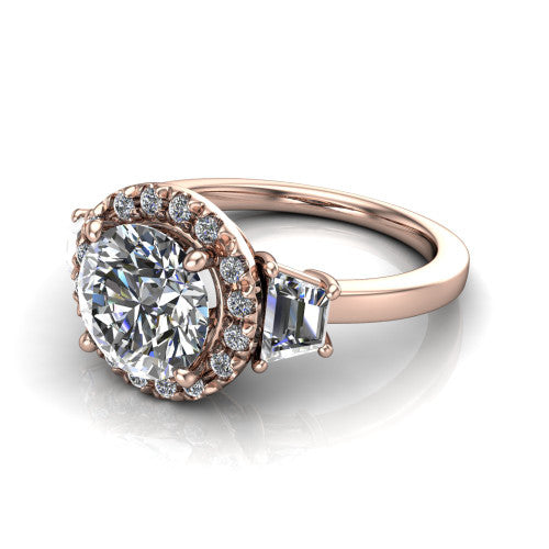 Anabella round halo engagement ring in 18K Rose Gold, three-quarter perspective showing the round center diamond, pave halo, and two trapezoid side stones