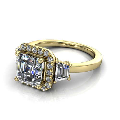 Anabella square emerald-cut halo engagement ring in 14K Yellow Gold, three-quarter perspective showing the square emerald-cut center diamond, pave halo, and two trapezoid side stones