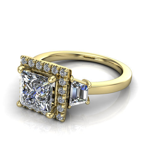 Anabella princess-cut halo engagement ring in 18K Yellow Gold, three-quarter perspective showing the princess-cut center diamond, pave halo, and two trapezoid side stones