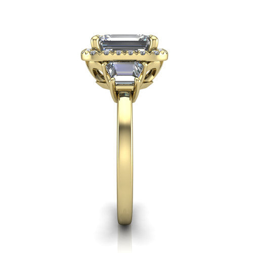 Anabella emerald-cut halo engagement ring in 18K Yellow Gold, side profile showing the halo, side stones, and polished band in profile