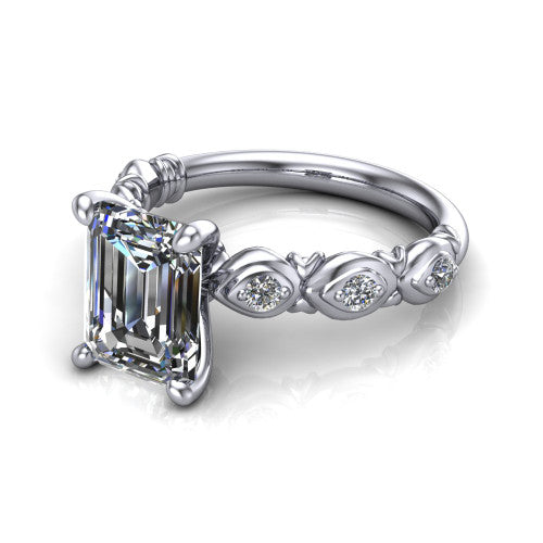 Nyla emerald-cut solitaire engagement ring in 18K White Gold, three-quarter perspective showing the emerald-cut center diamond above a vintage marquise-station accent band
