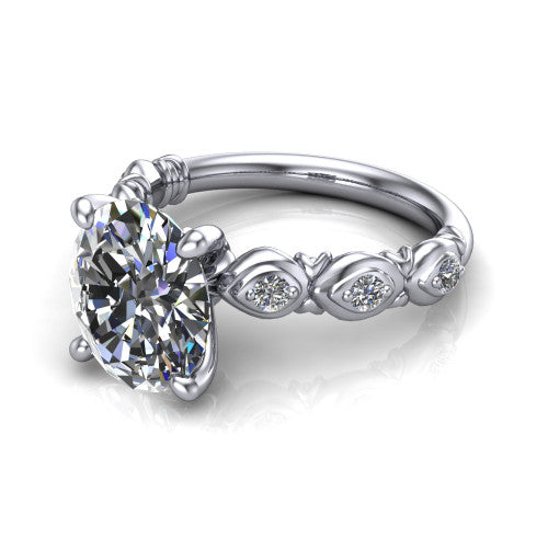 Nyla oval solitaire engagement ring in Platinum, three-quarter perspective showing the oval center diamond above a vintage marquise-station accent band