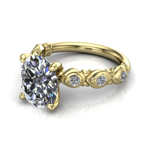 Nyla oval solitaire engagement ring in 18K Yellow Gold, three-quarter perspective showing the oval center diamond above a vintage marquise-station accent band