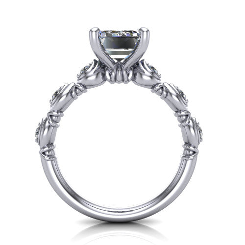 Nyla emerald-cut solitaire engagement ring in Platinum, through-finger front profile showing the marquise-and-dot band and open gallery from the front