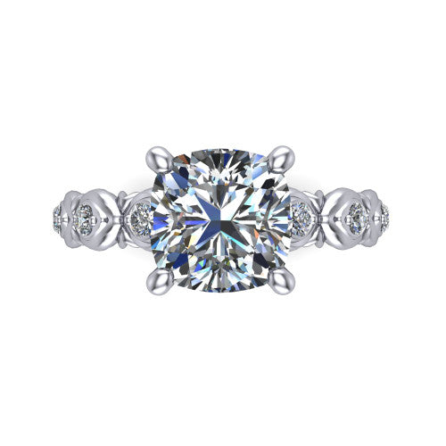 Nyla cushion solitaire engagement ring in Platinum, top-down view showing the cushion center diamond and station shoulders from above