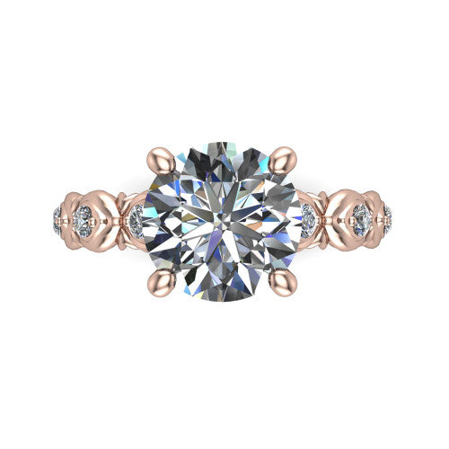 Nyla round solitaire engagement ring in 18K Rose Gold, top-down view showing the round center diamond and station shoulders from above
