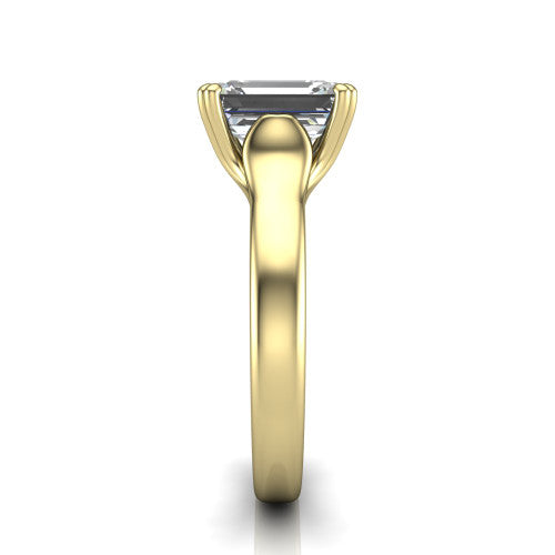Faith emerald-cut classic engagement ring in 18K Yellow Gold, side profile showing the cathedral setting and polished band in side view