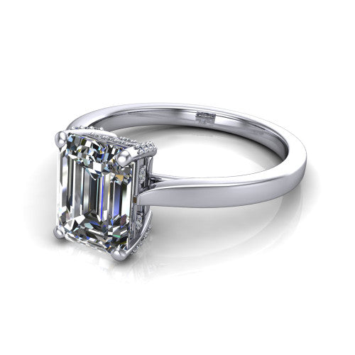 Finley emerald-cut classic engagement ring in Platinum, three-quarter perspective showing the emerald-cut center diamond in a four-prong head with a hidden halo