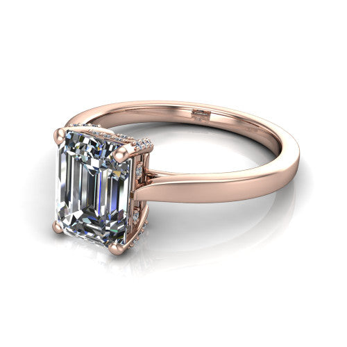 Finley emerald-cut classic engagement ring in 14K Rose Gold, three-quarter perspective showing the emerald-cut center diamond in a four-prong head with a hidden halo