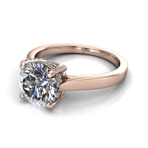 Finley round classic engagement ring in 18K Rose Gold, three-quarter perspective showing the round center diamond in a four-prong head with a hidden halo