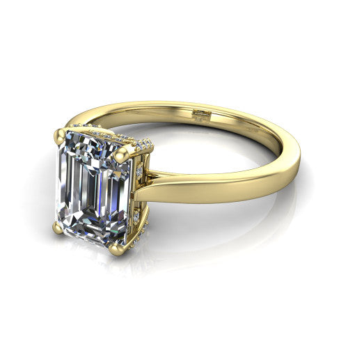 Finley emerald-cut classic engagement ring in 14K Yellow Gold, three-quarter perspective showing the emerald-cut center diamond in a four-prong head with a hidden halo